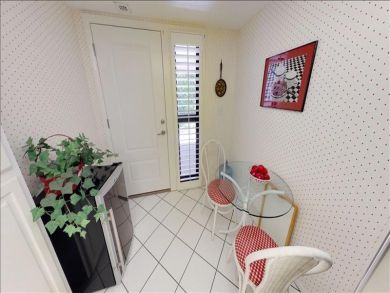 Just Steps to the Sandy Beach from this Two Bedroom Condo